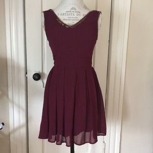 Burgundy dress with gold detailing